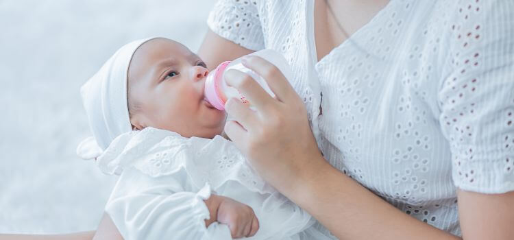 how to stop a baby from clicking while bottle feeding